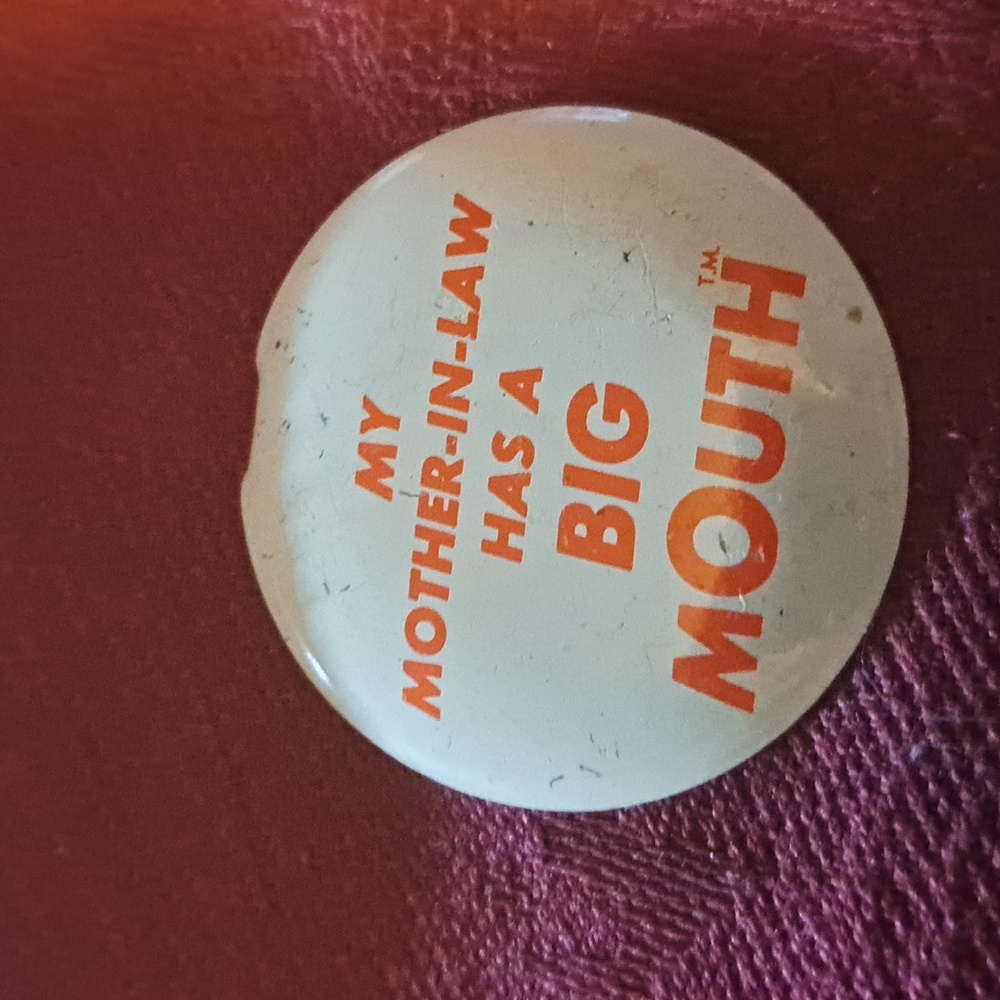 My mother-in-law has a big mouth button pin lapel vintage brooch